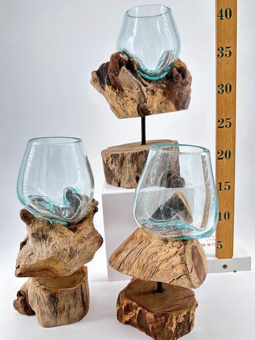 Elegant drinking glasses on rustic wooden bases, enhancing home decor and entertaining styles.